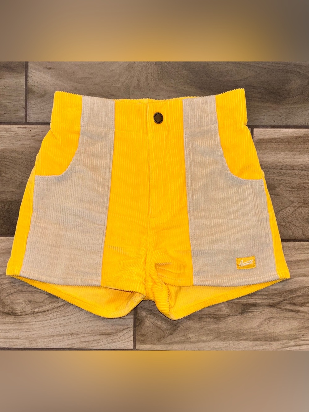 “Hammies High-Waist Two-Tone Corduroy Shorts in yellow/sand; 1970’s inspo. SZ 24